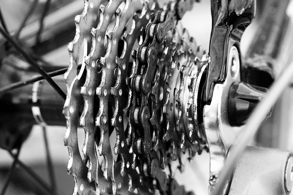 Detail view of bicycle chainrings with cogwheels.