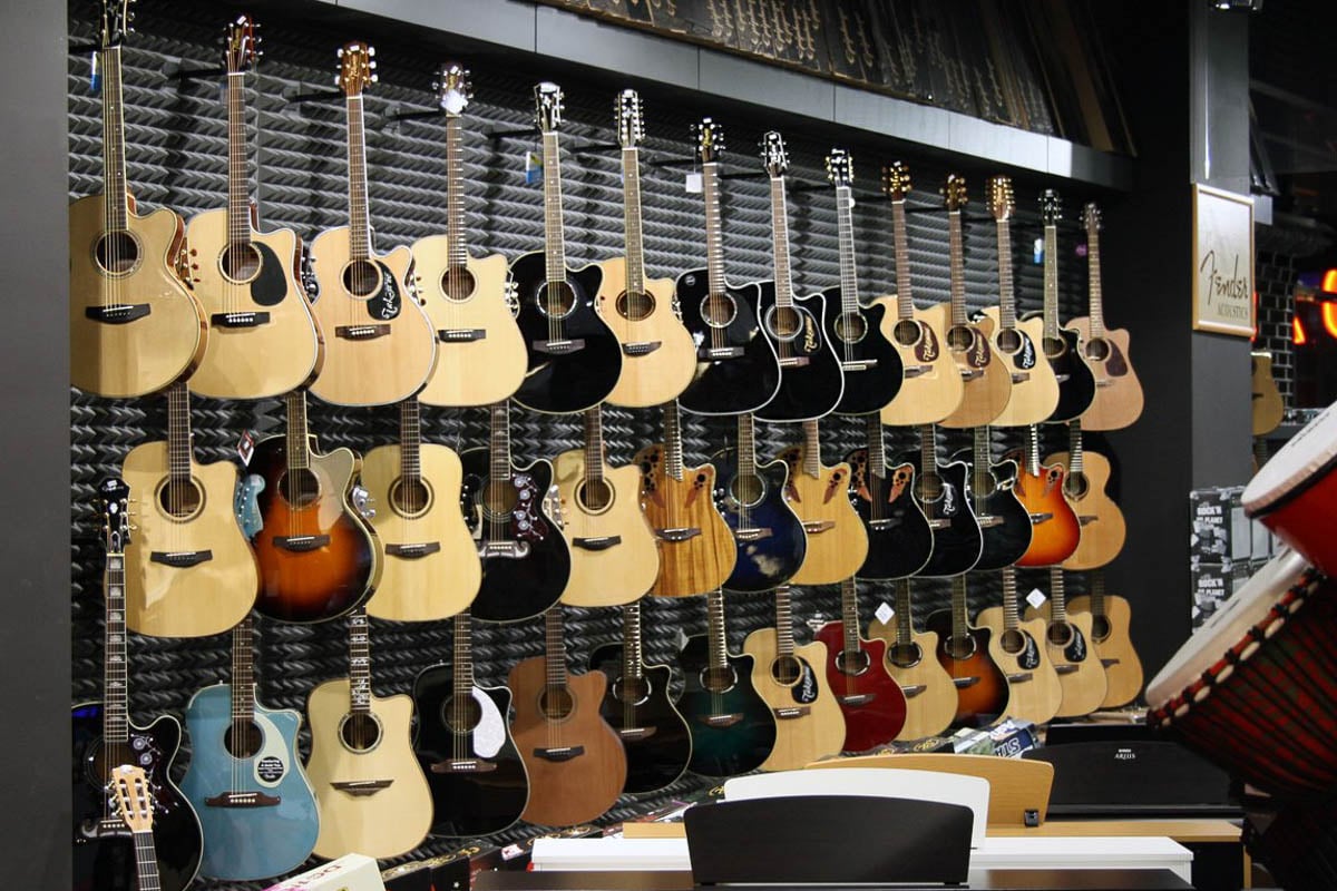 Guitars in musical instruments shop Muziker Ostrava.