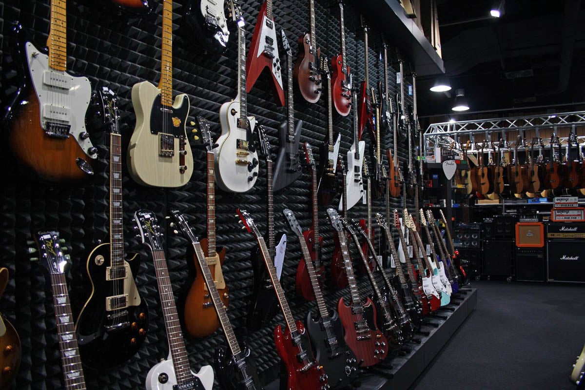 Guitars in musical instruments shop Muziker Ostrava.
